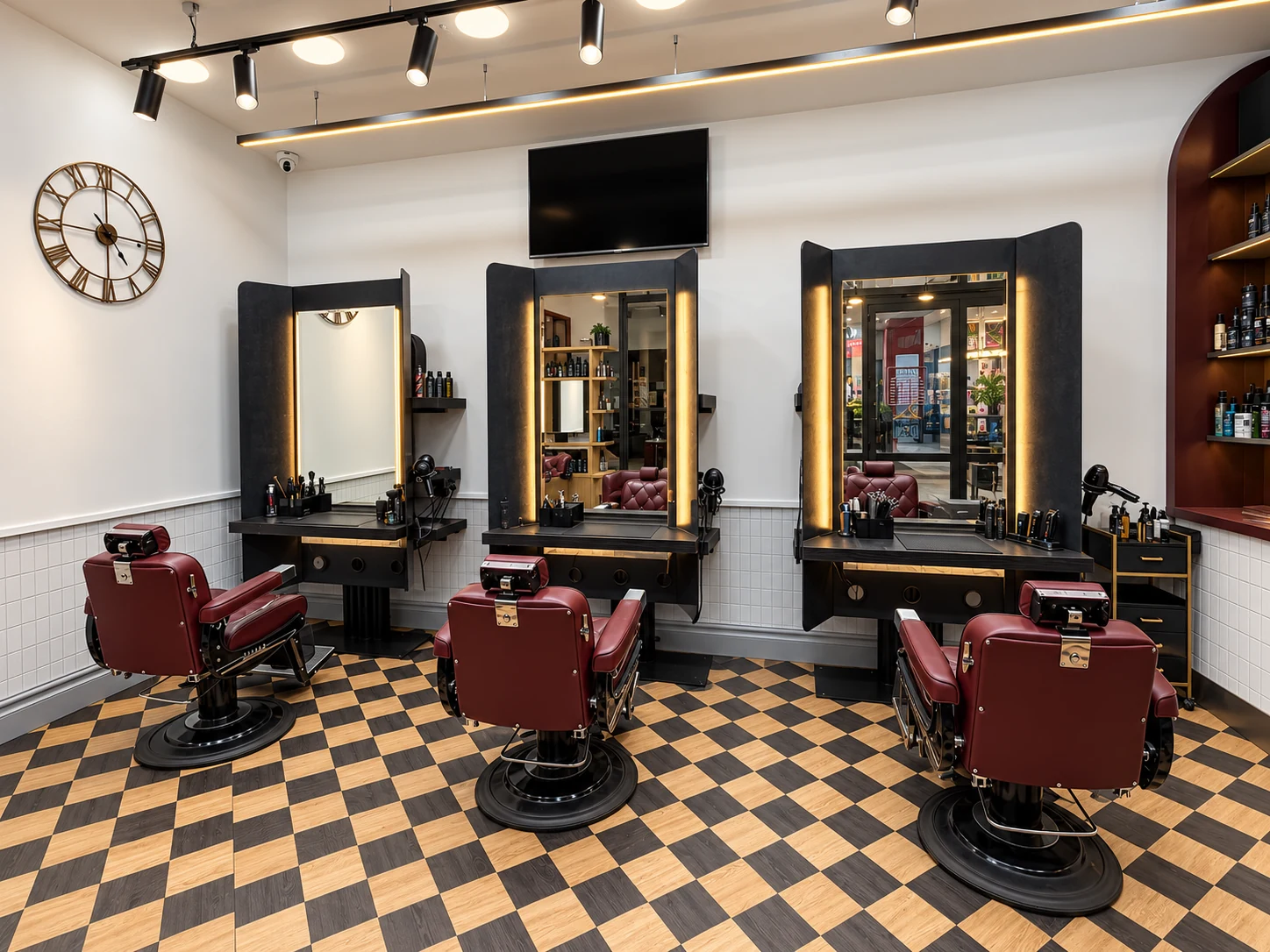 Burgundy barber chairs and illuminated mirrors